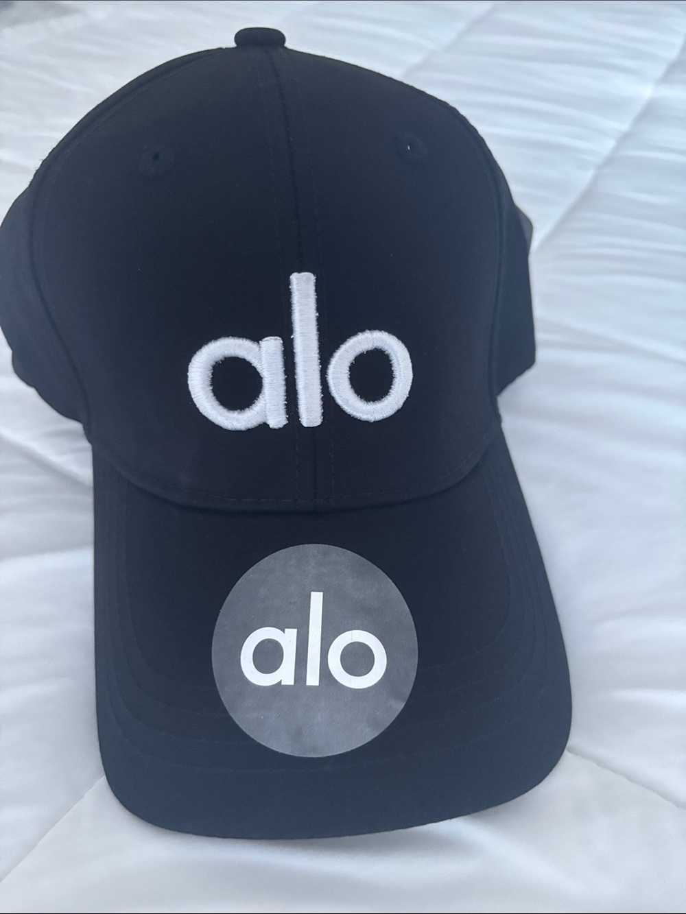 ALO Yoga Men’s Black Cap with White Logo
